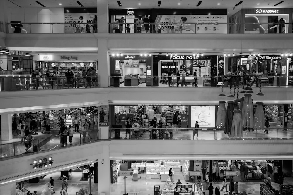 a black and white photo of a shopping mall