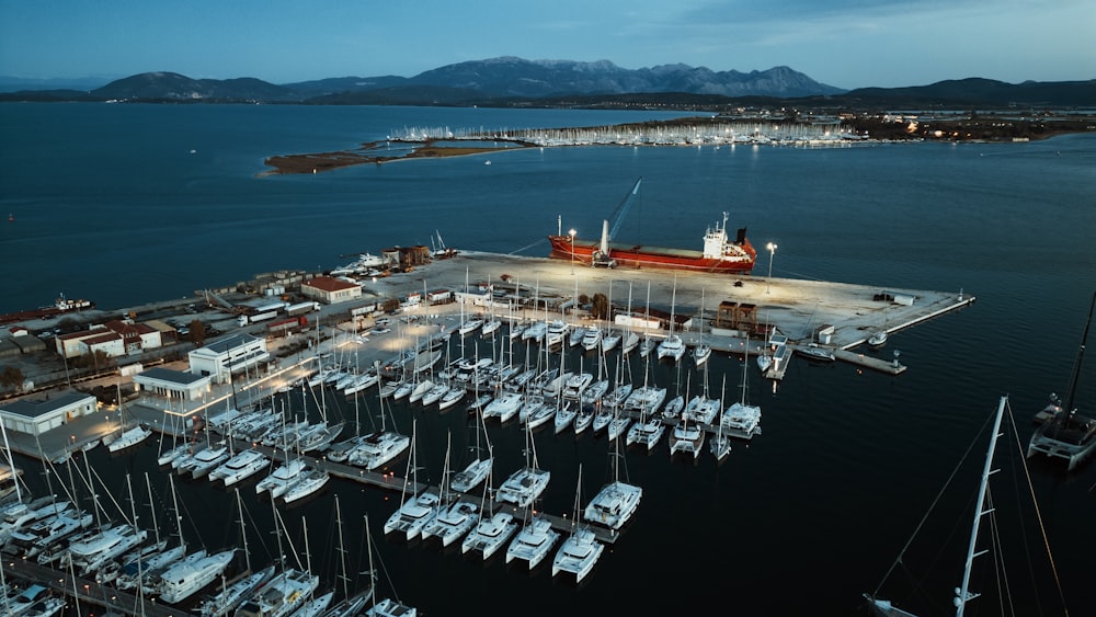 a boat dock with many boats docked in it