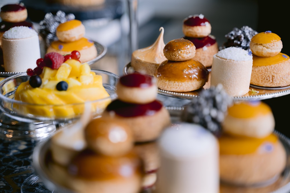 a table topped with lots of different types of pastries