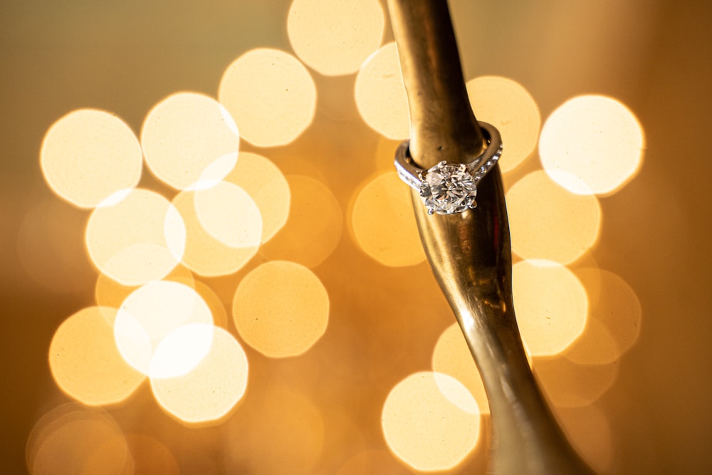 a close up of a wedding ring on a spoon