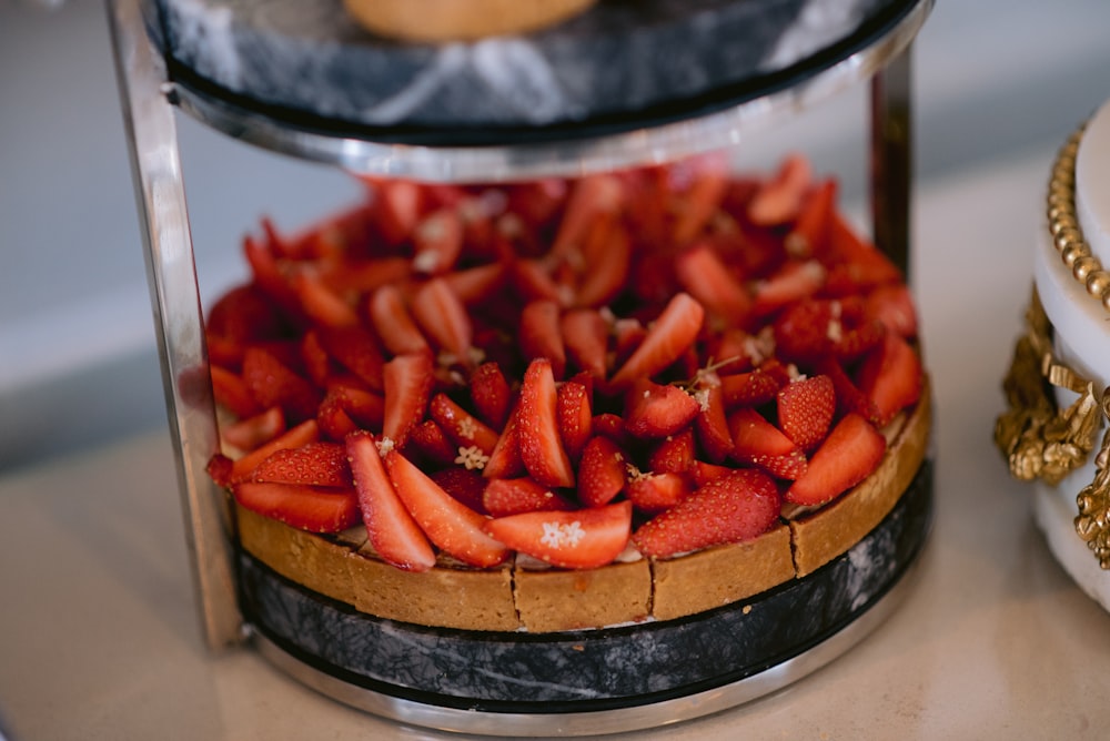 a close up of a cake with strawberries in it