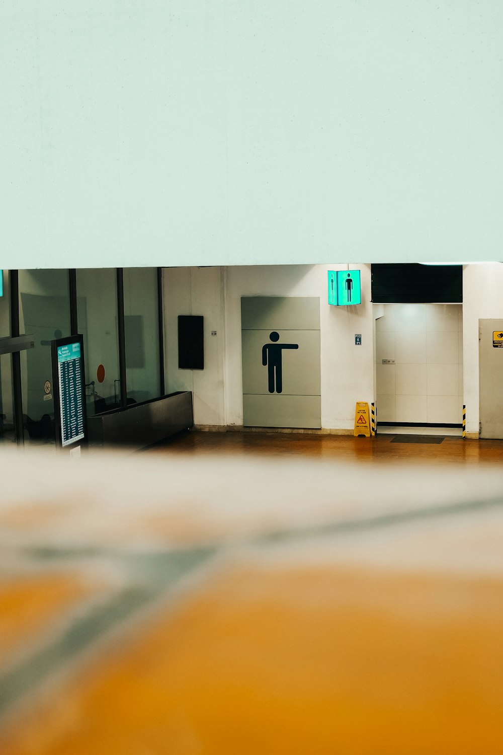 a picture of a room with a door and a sign on the wall