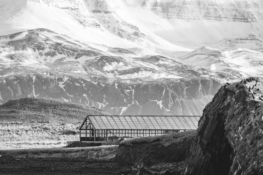 a black and white photo of a snow covered mountain