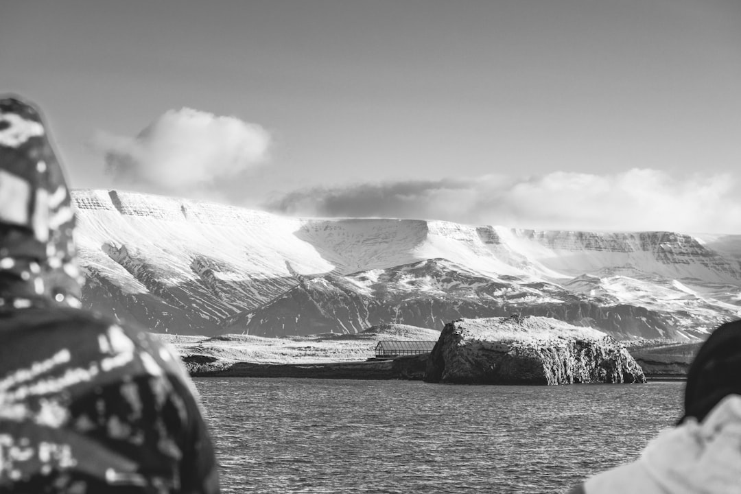 a couple of people that are standing in the snow,
