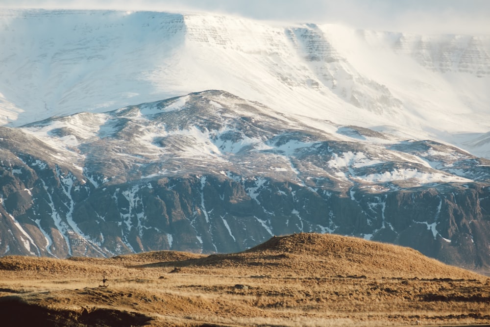 a large mountain covered in snow in the distance