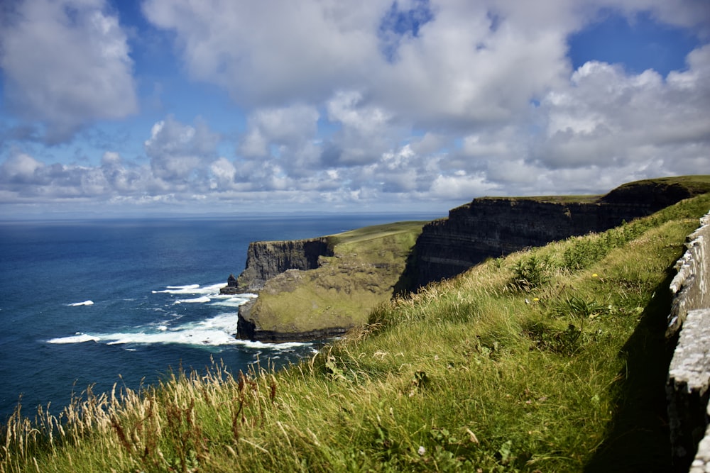 a scenic view of the ocean and cliffs