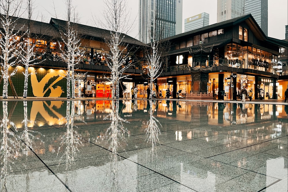 a building that has a lot of trees in front of it