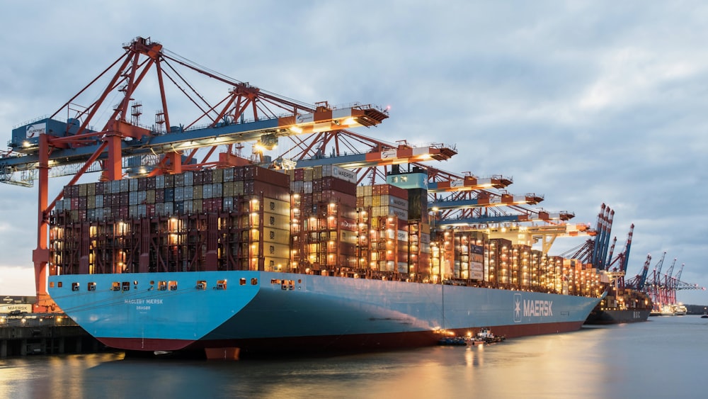 a large cargo ship docked at a dock