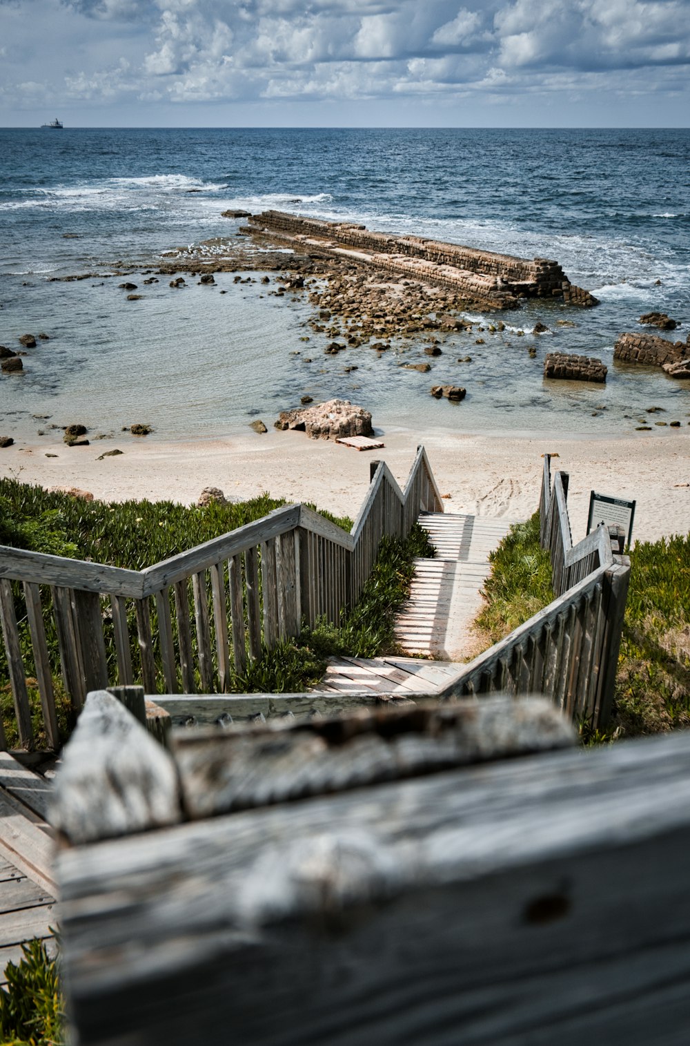 a set of stairs leading down to the beach