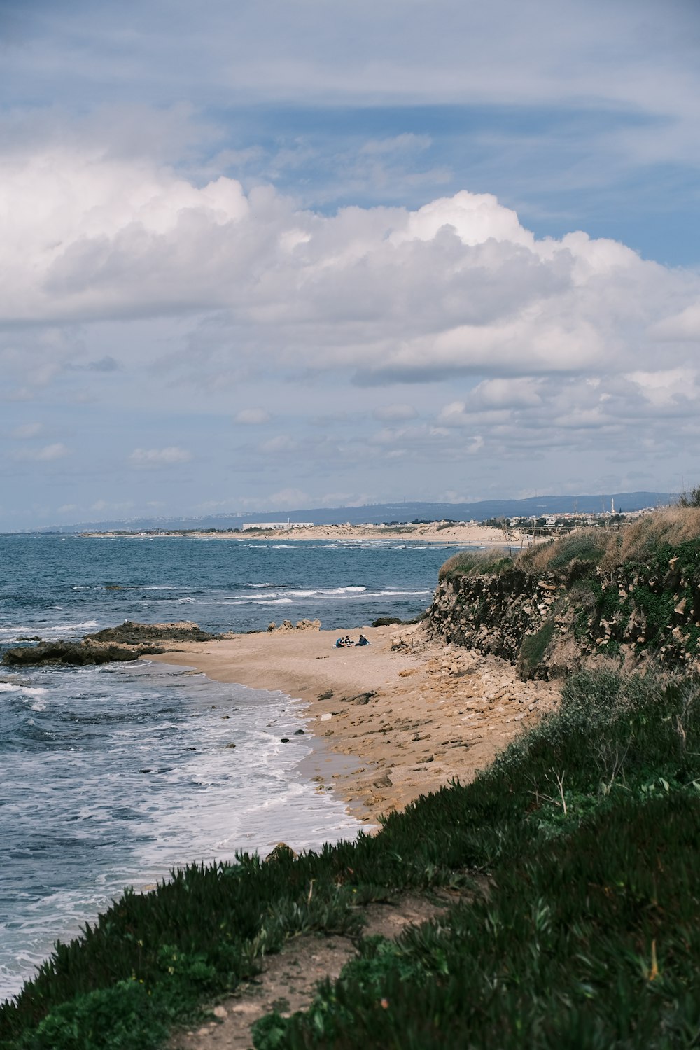 a view of the ocean from the shore of a beach