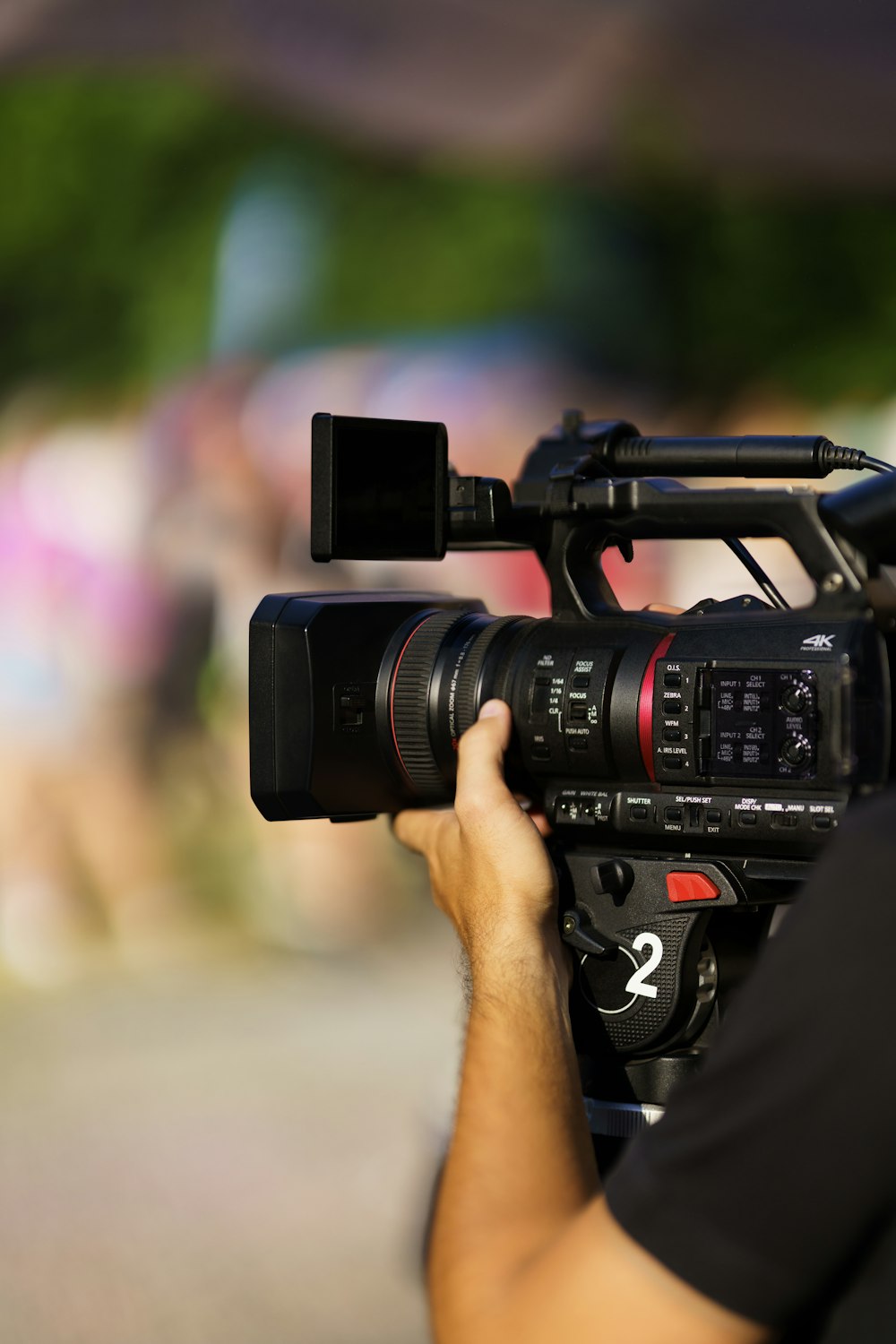 a man holding a camera in front of a camera