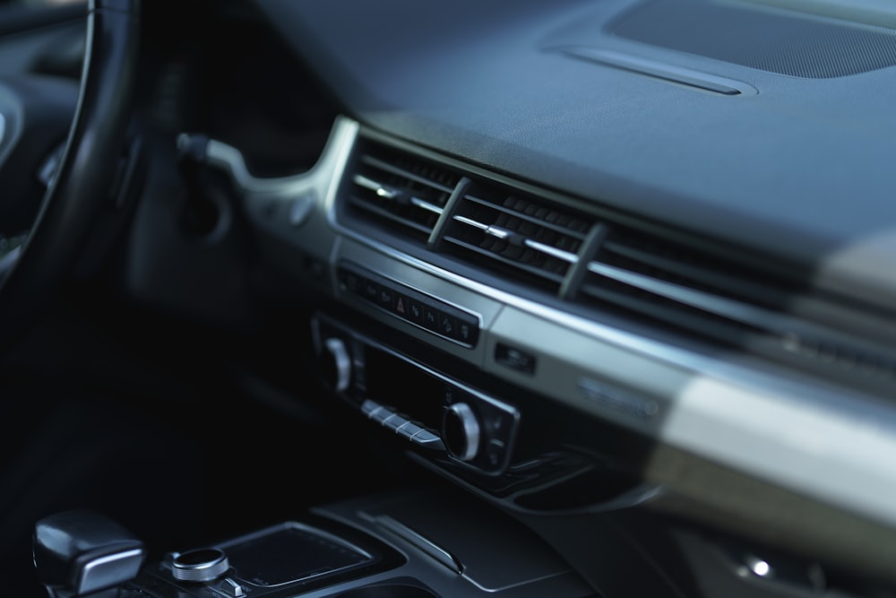 a close up of a steering wheel and dashboard of a car