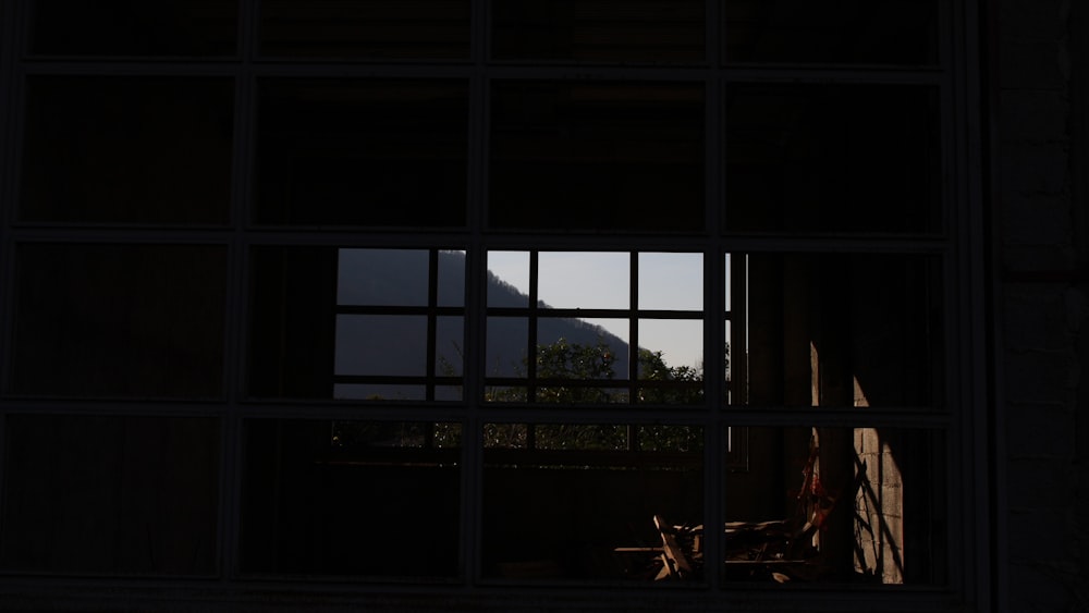 a window with a view of a mountain outside