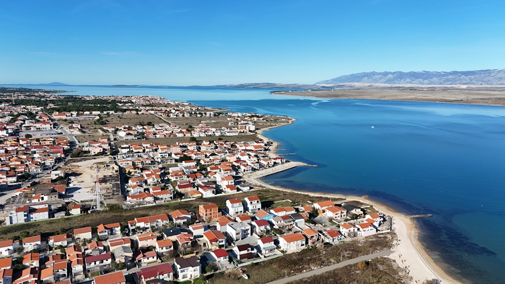 a bird's eye view of a small town by the water