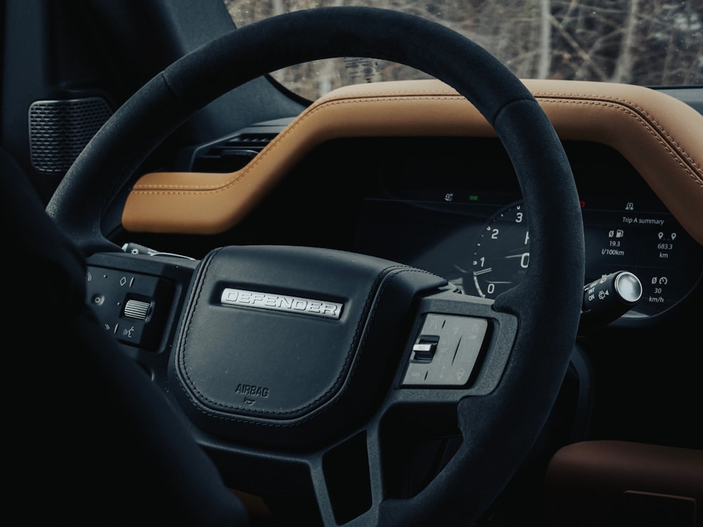 the interior of a car with a steering wheel