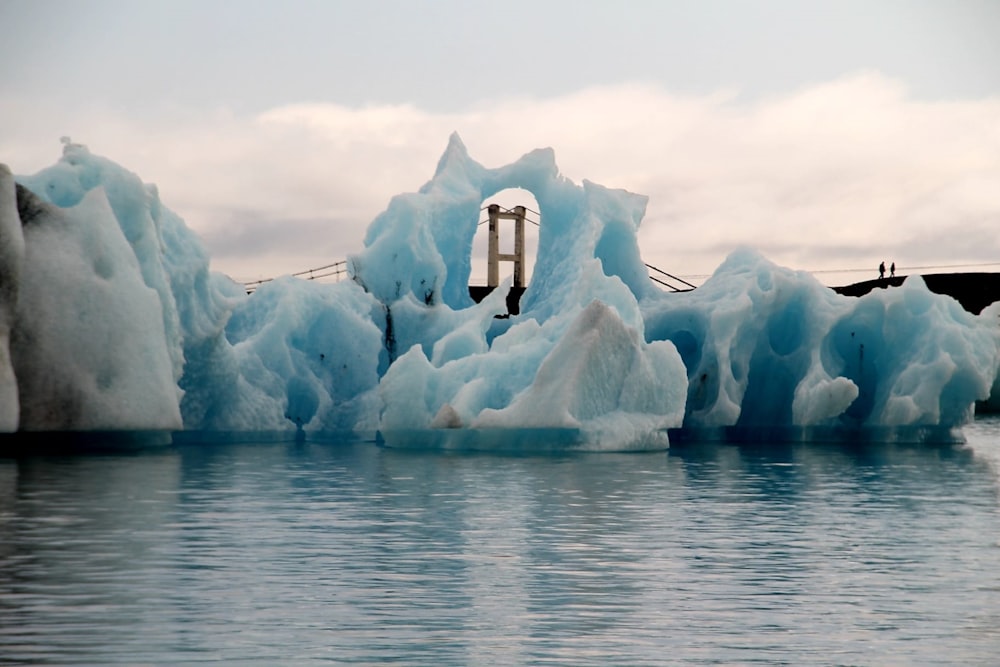 a group of icebergs that are floating in the water