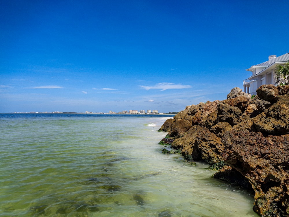 a view of the ocean from a rocky shore