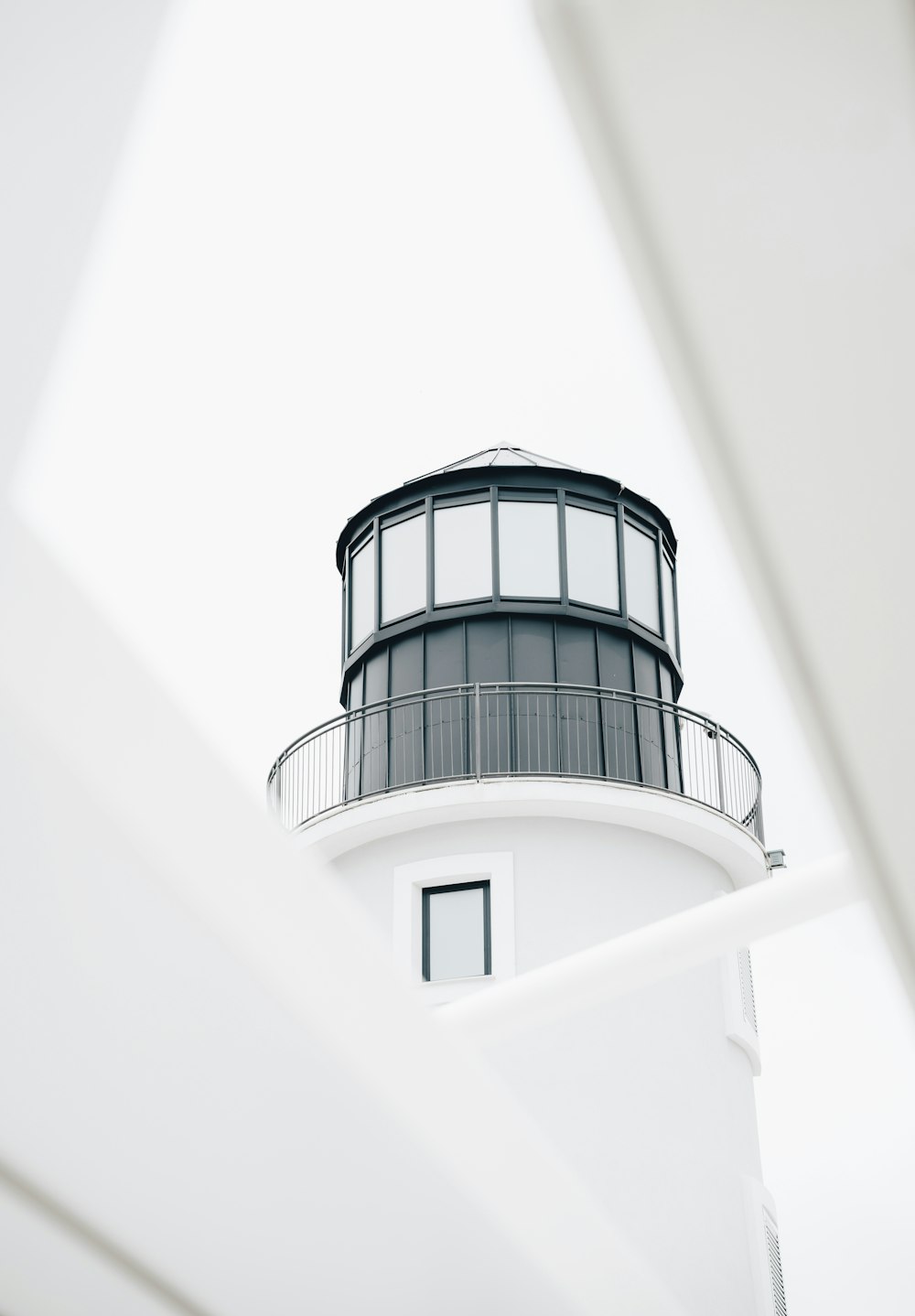 a black and white photo of a lighthouse