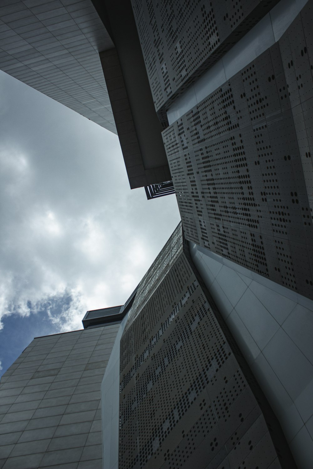 a tall building with a sky in the background