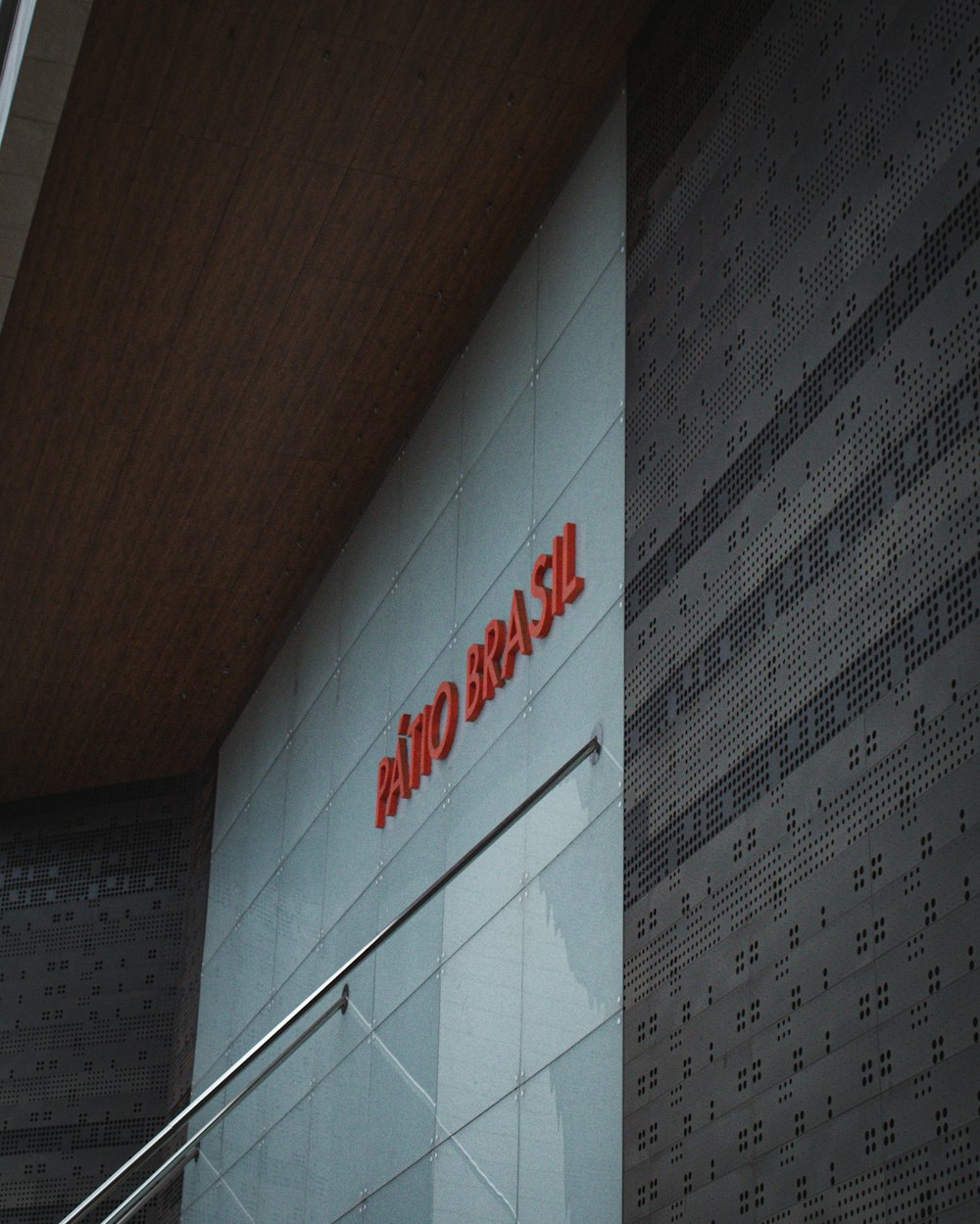 a red and white sign on the side of a building