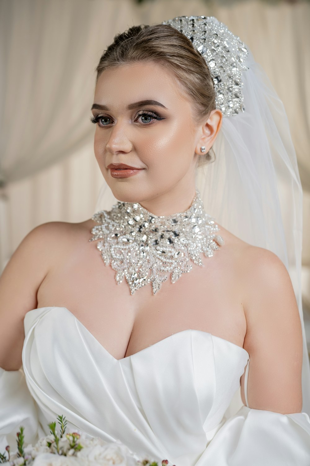 a woman in a wedding dress wearing a tiara