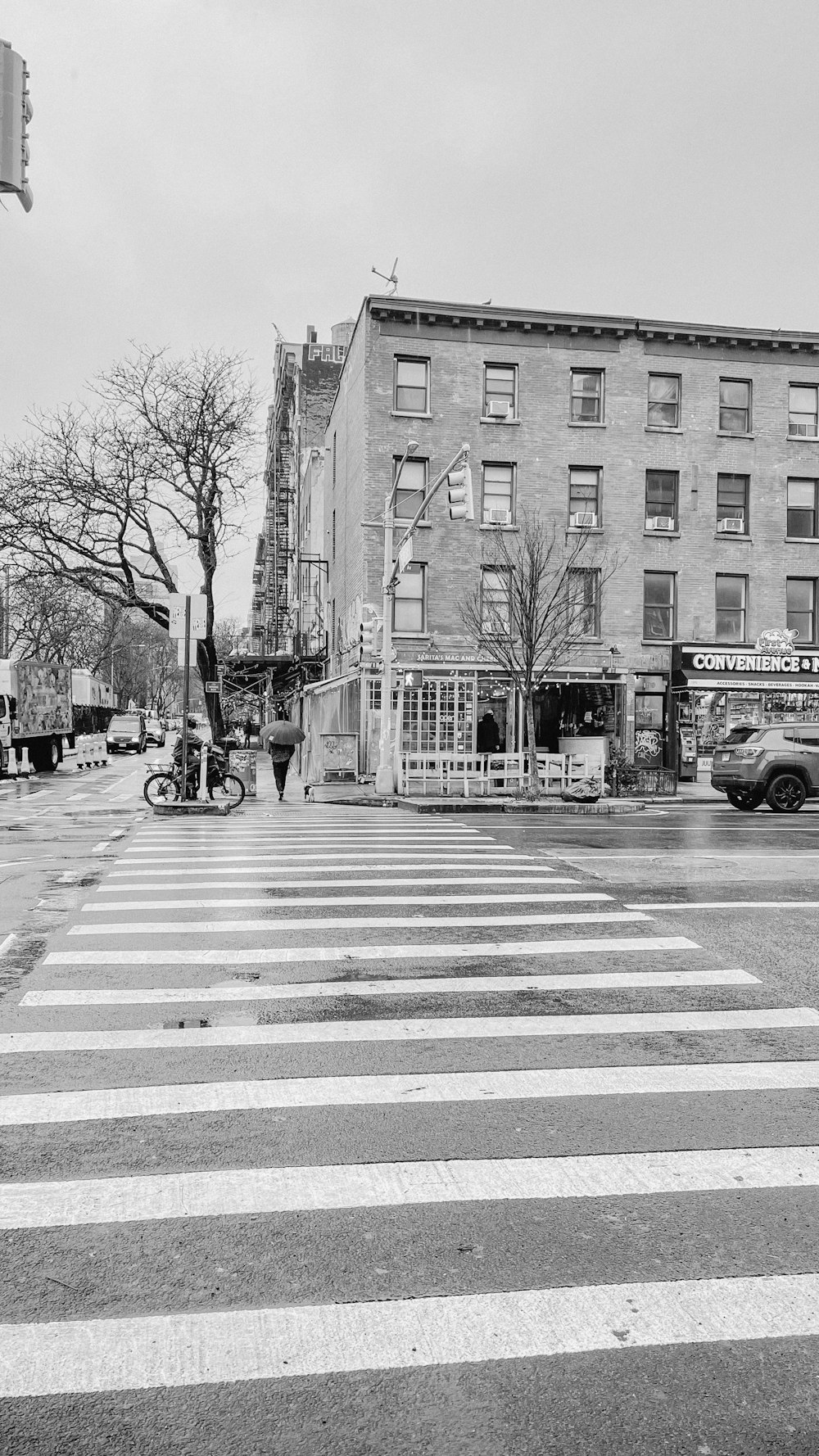 a black and white photo of a cross walk