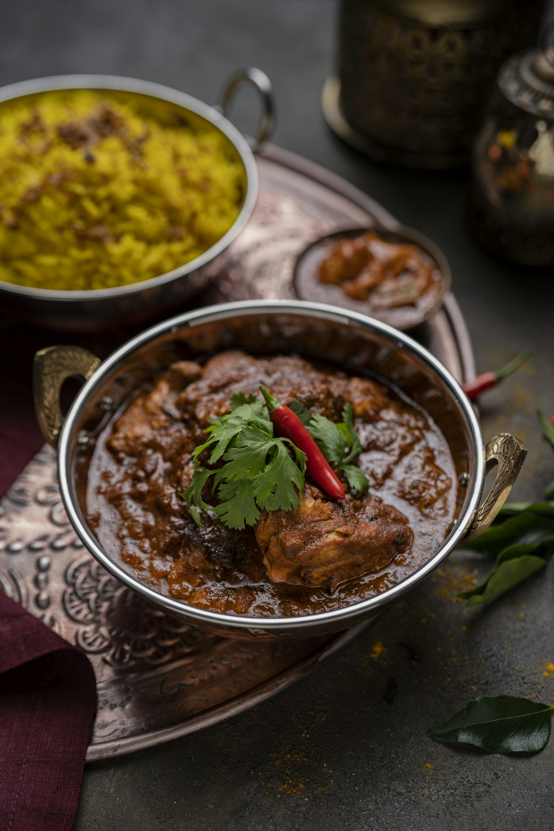 a bowl of food on a table with other dishes