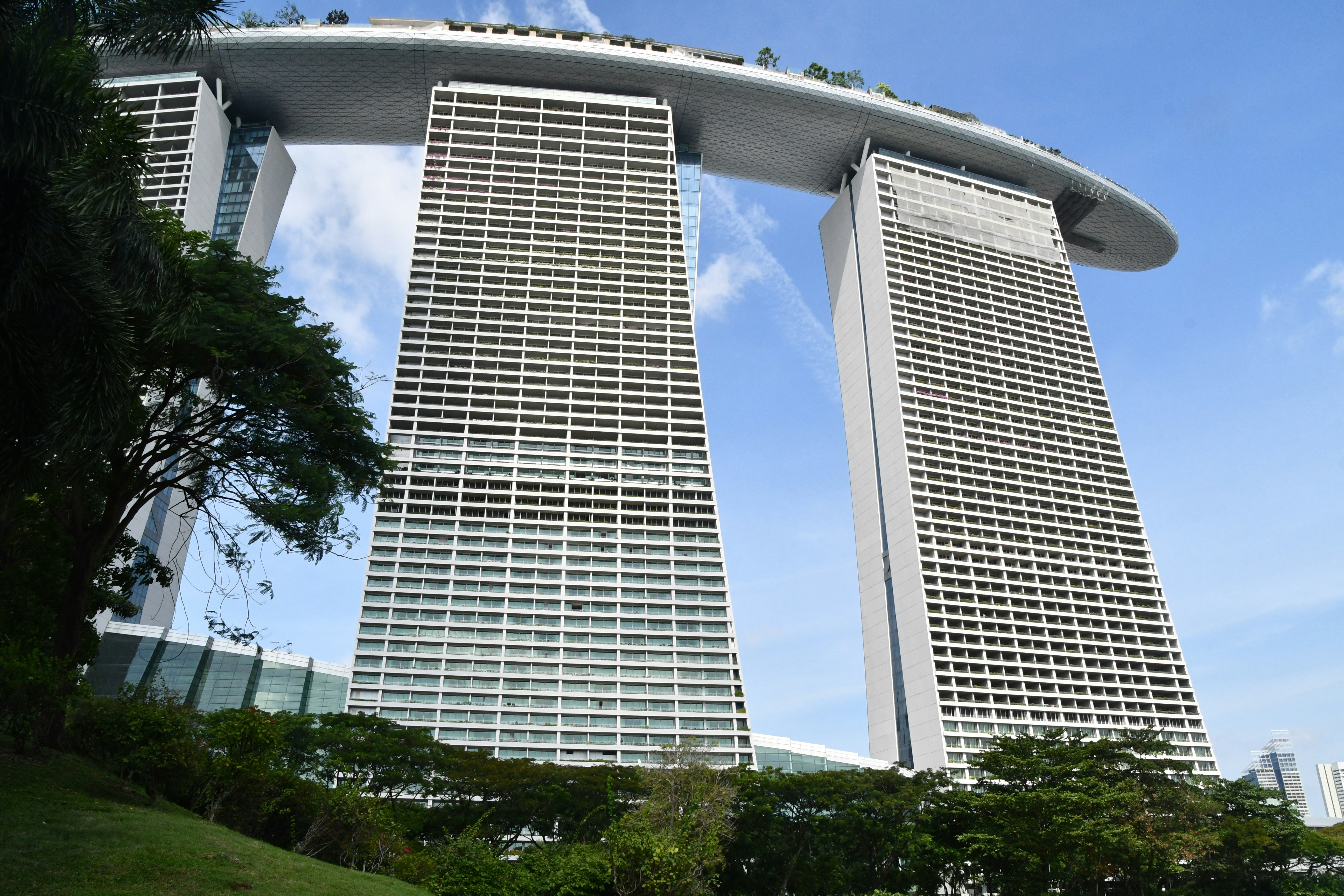 a couple of tall buildings sitting next to each other