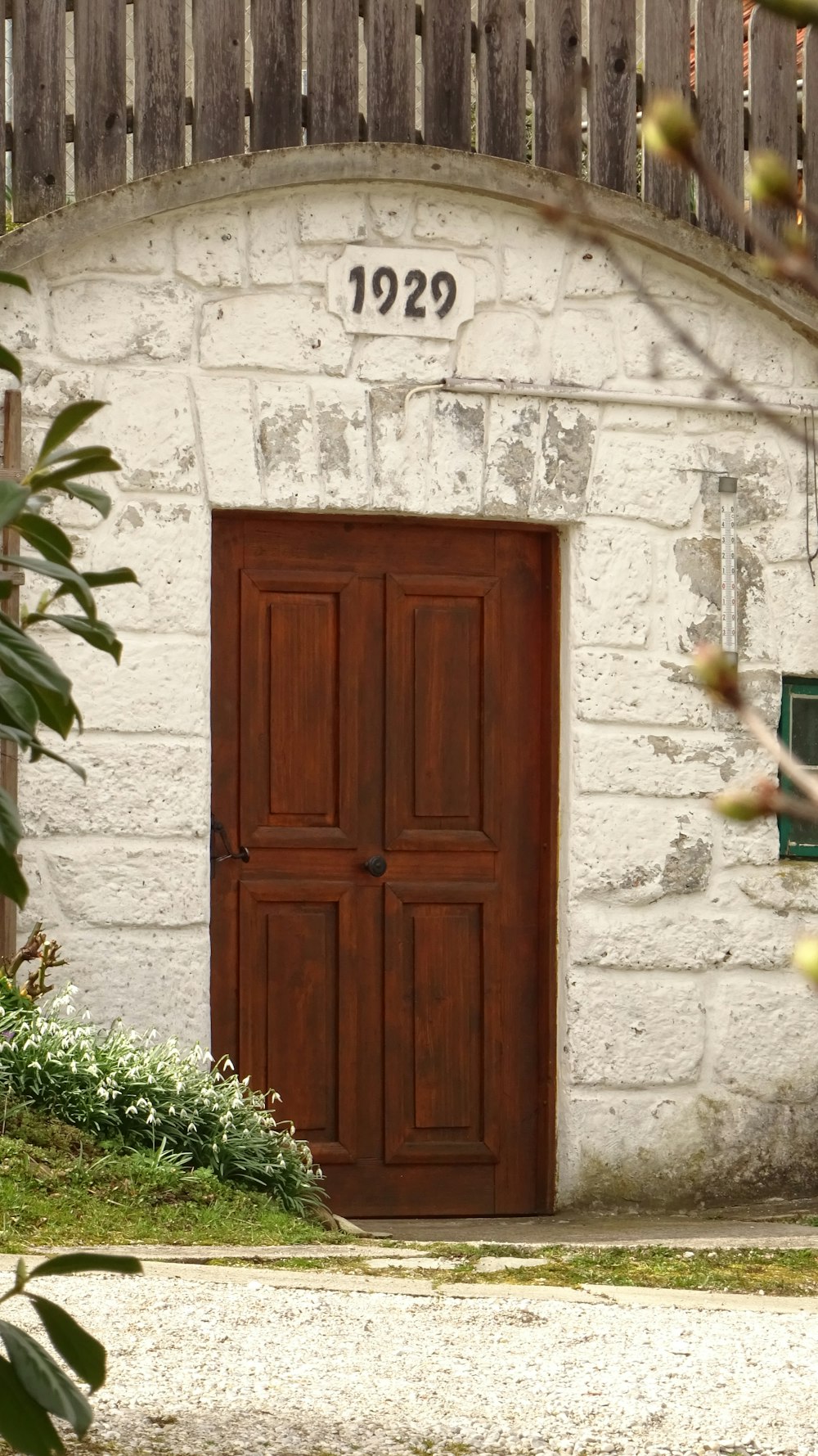 an old brick building with a wooden door