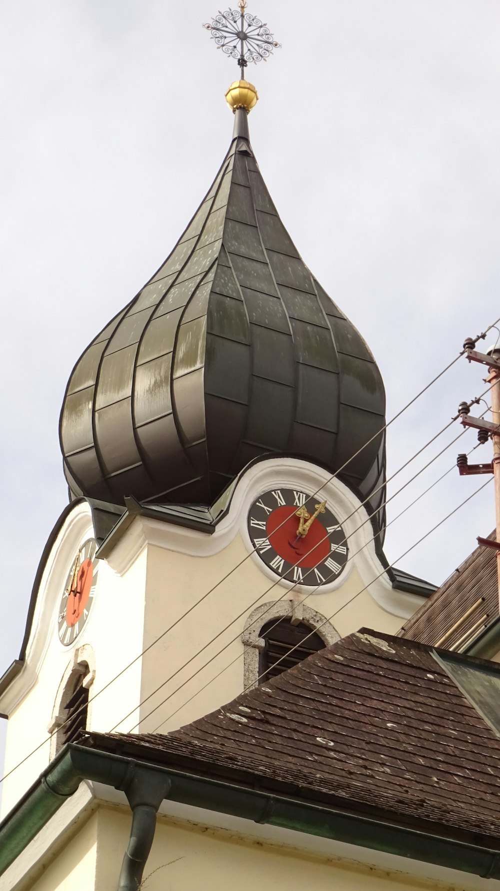 a church steeple with a clock on it