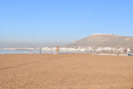 a beach with a mountain in the background