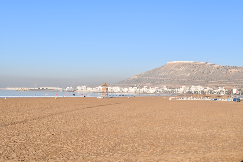 a beach with a mountain in the background