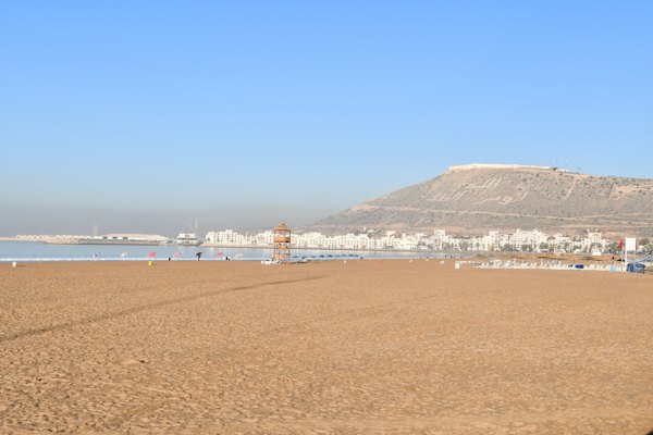 A beach with a mountain in the background — Agadir, Morocco