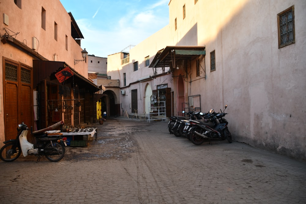 a street with a few motorcycles parked on the side of it