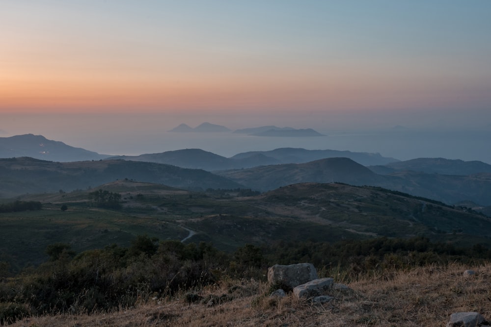 a view of a mountain range at sunset