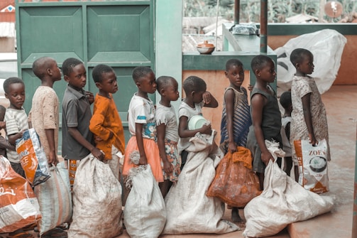 a group of young children standing next to each other