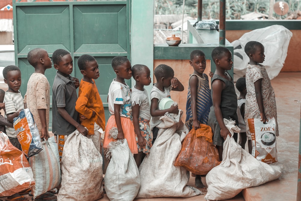 a group of young children standing next to each other