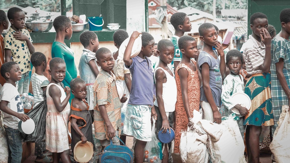 a group of children standing next to each other