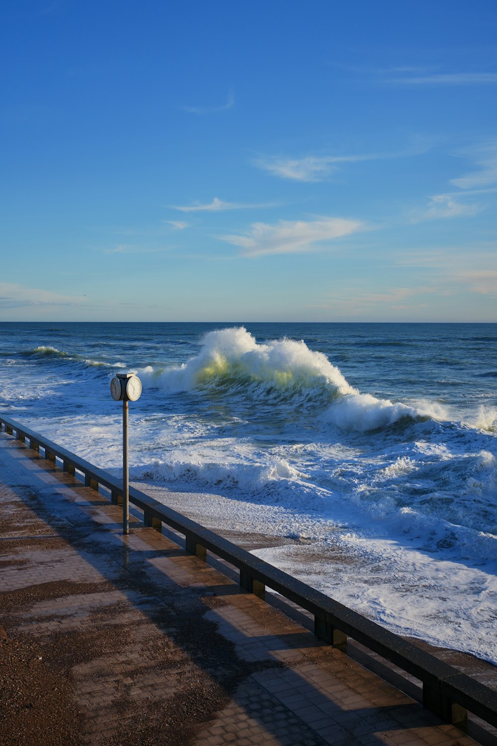 a large body of water with waves coming in to shore