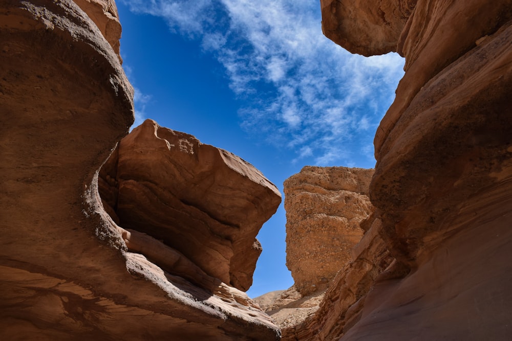 a narrow canyon with a sky in the background