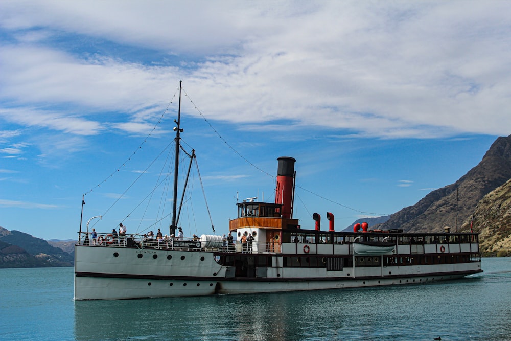 a large boat floating on top of a body of water