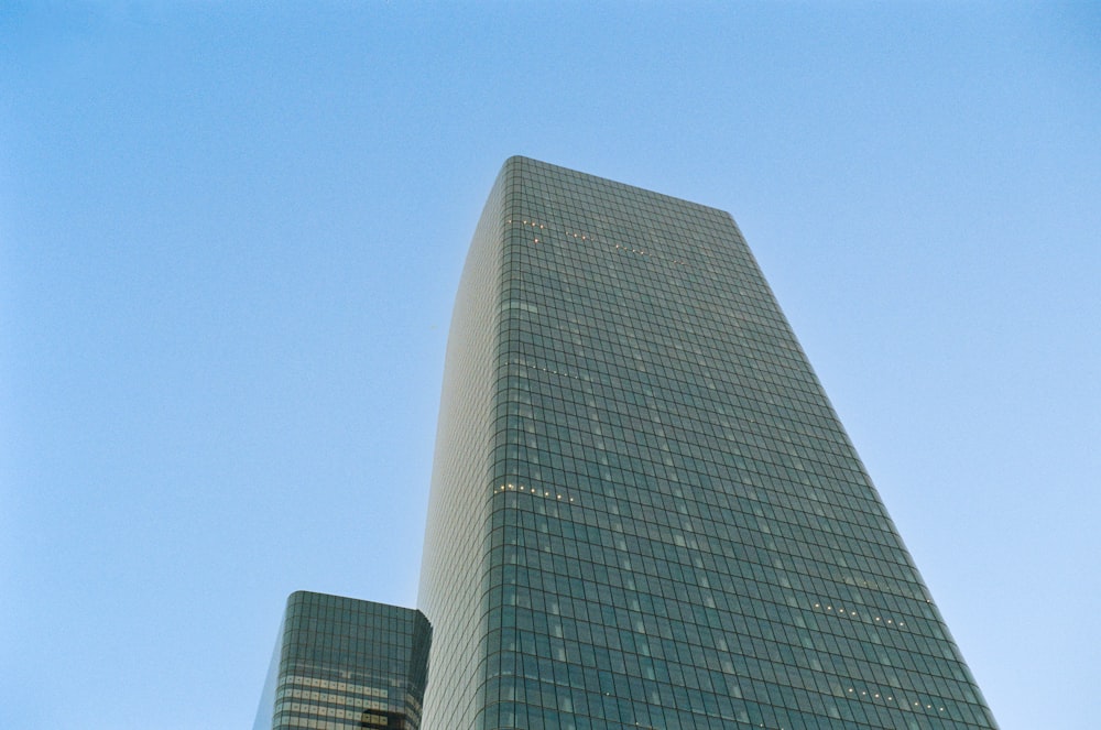 a very tall building with a very tall clock on it's side