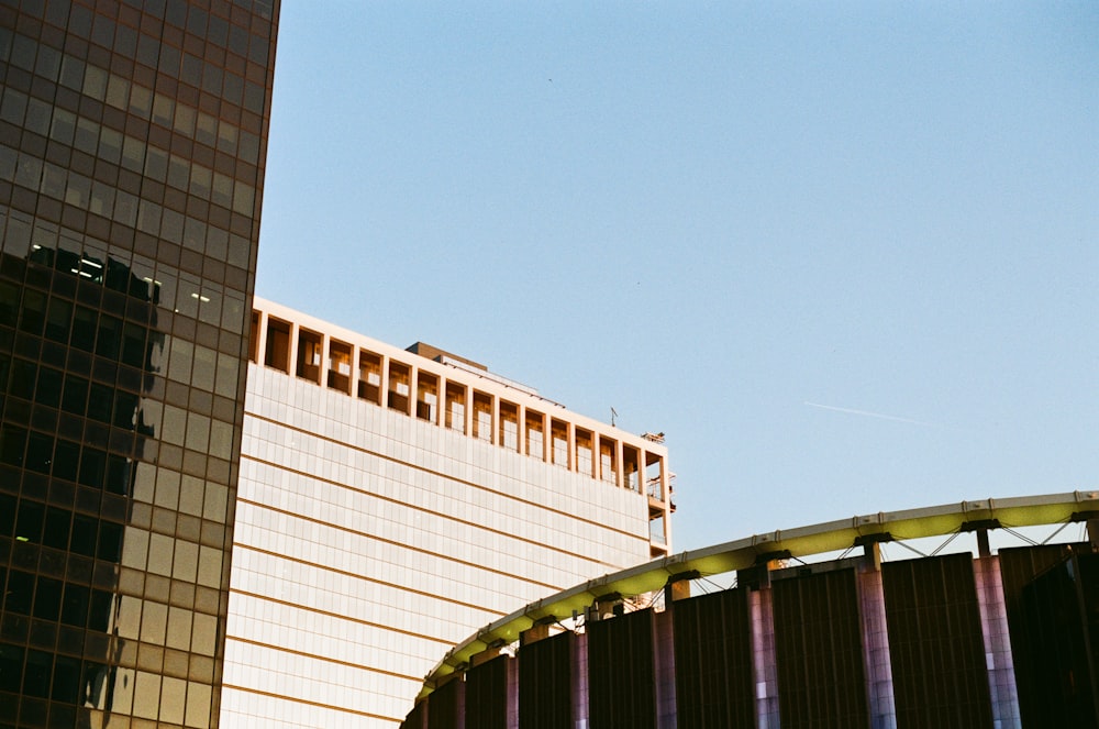 a tall building next to a very tall building