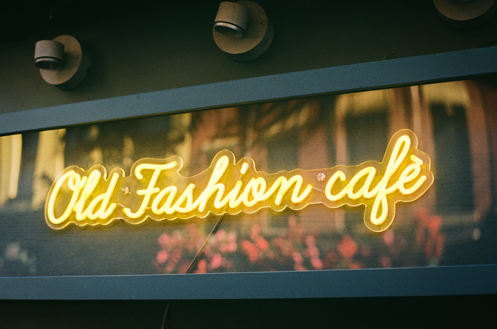 a neon sign that reads old fashion cafe