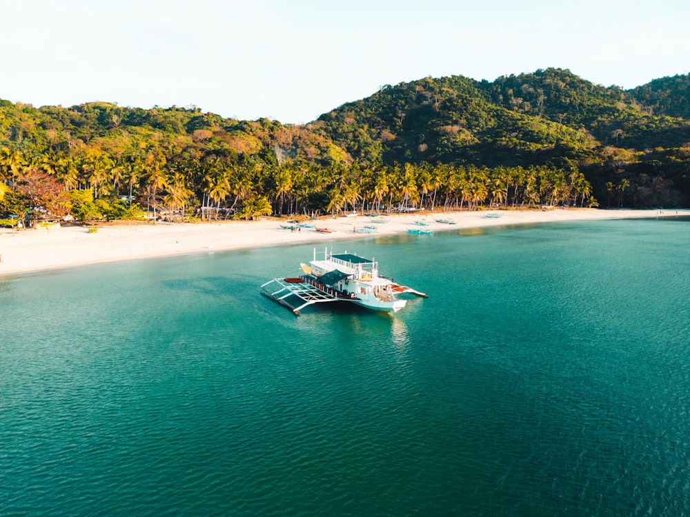 a boat floating on top of a large body of water