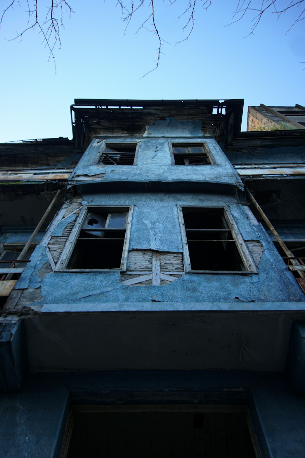 an old building with a broken down window