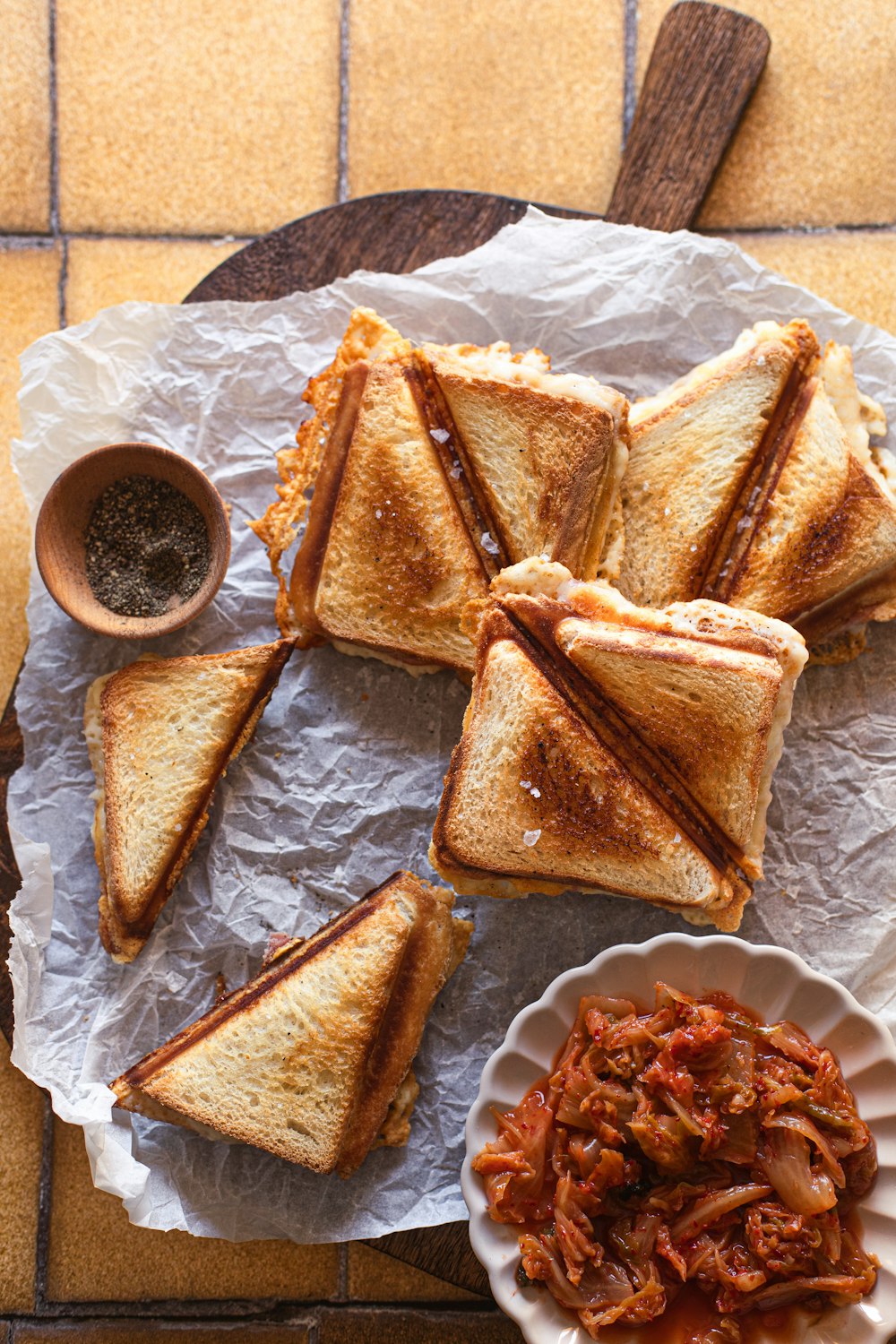 a plate of sandwiches and a bowl of chili