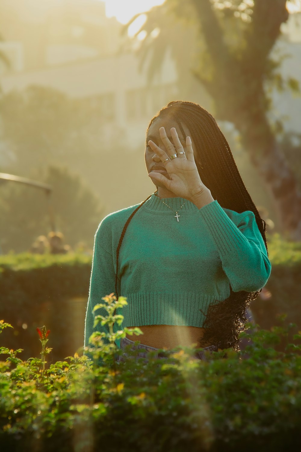 a woman covering her face with her hands