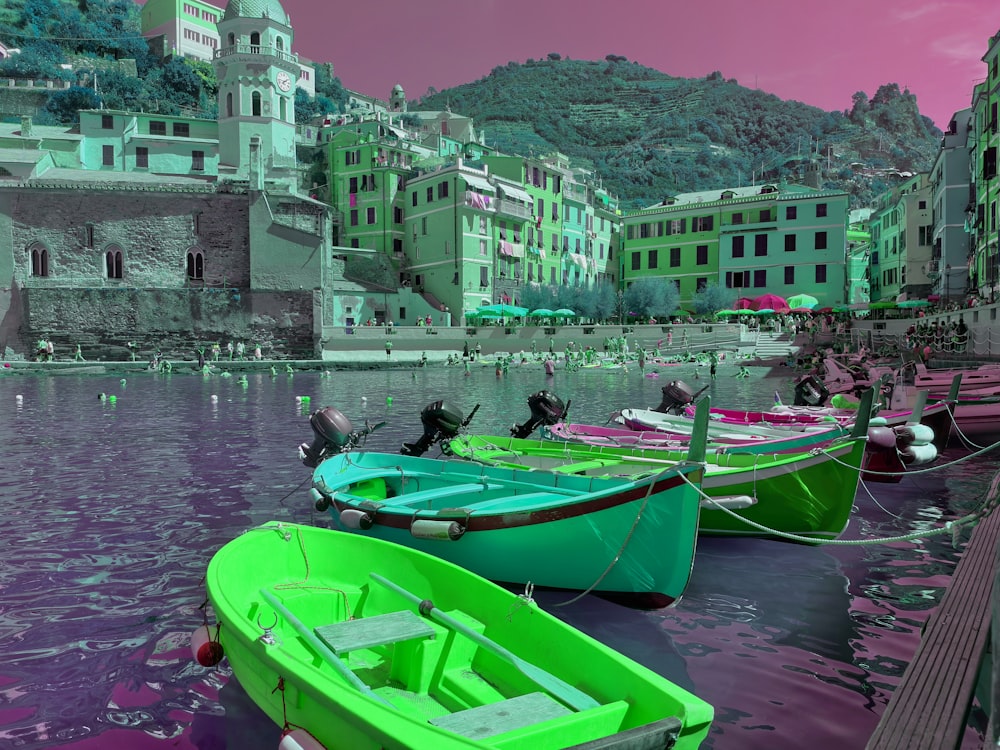 a group of small boats tied to a dock