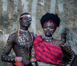 a couple of people standing next to each other